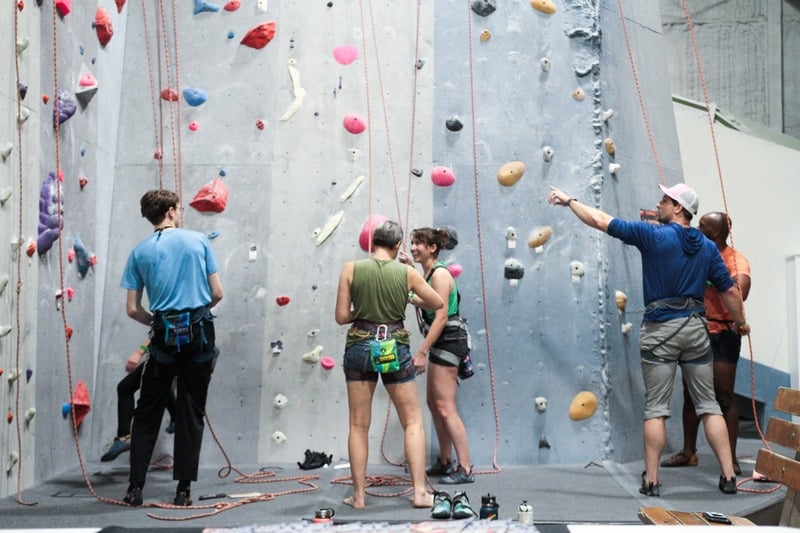 Climber reaching for hold at The Knot